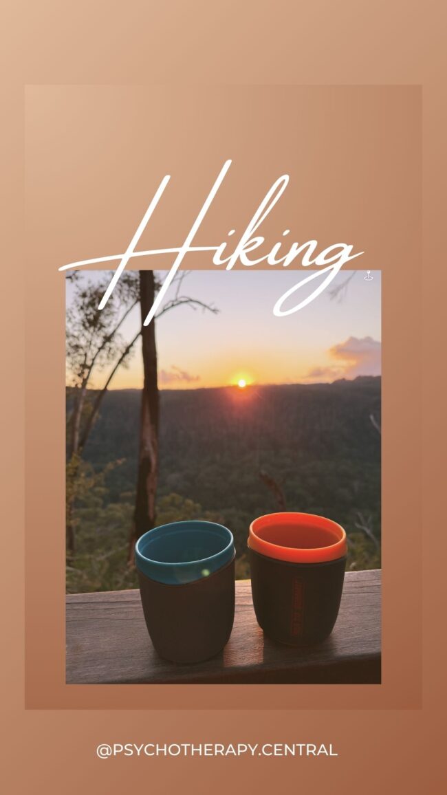 Jenny Nurick hiking the Gidjuum Gulganyi walk through the Australian bush, surrounded by nature and wildflowers.